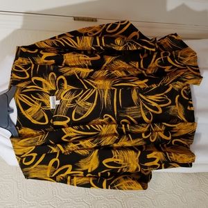 Vintage 1980s blazer, si,e medium, colors gold and black.